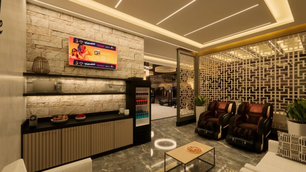 Lounge de convivência da DF Premium com café, cadeiras de massagem e televisão